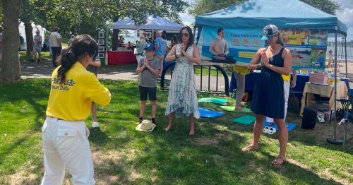 Learning Falun Dafa exercises at the annual Folk Festival